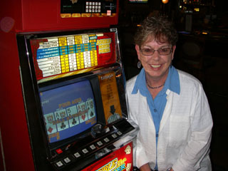 Shar, with one of her sets of Aces on a dollar DB machine, shown to the right.